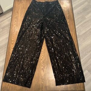 Black flashy sequin pants. Size 6.